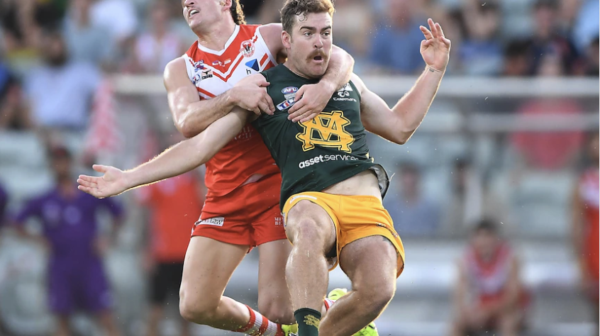 A Warratahs player tackling a Saint Marys in the 2022 grand final